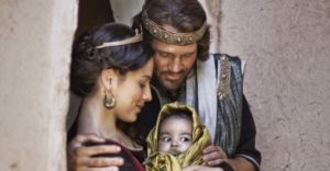 David and Bathsheba holding baby Solomon and gazing at him adoringly